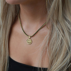 Collier smiley cordon noir or
