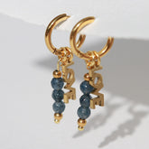 Gouden oorbellen facet love blauw