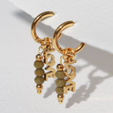 Gouden oorbellen facet love olijf