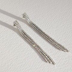 Gold earrings covered in diamonds