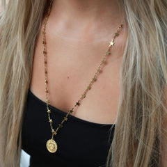 Gouden lange ketting maan en zon