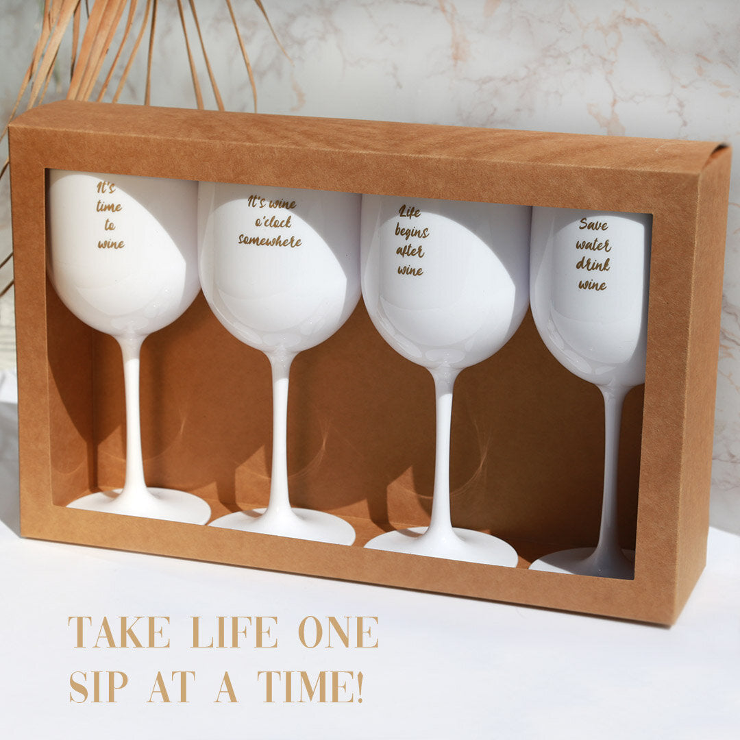 Wine glasses with golden quotes 